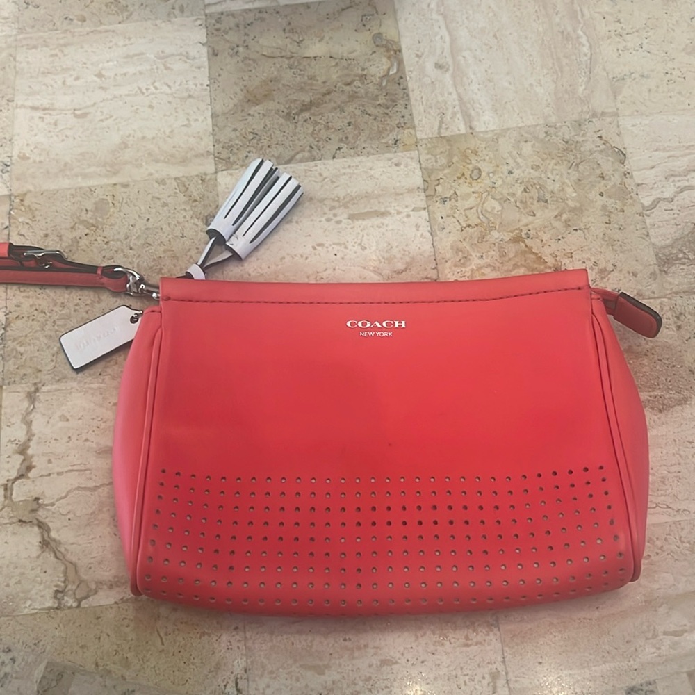 Coach wristlet coral and white gently used